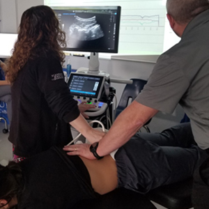 image Baton Rouge chiropractic ultrasound imaging of spinal vertebrae during treatment